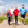 Family, mother, father and children are running or jogging for sport outdoors